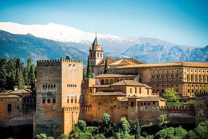 Andalusia’s complex history comprises successive invasions from the Phoenicians, Romans, Visigoths and the Islamic Moors who have left their rich cultural legacies on the landscape of Spain. The Moors, part of the Umayyad dynasty, were mainly a mixed race of Berbers and Arabs who crossed into Spain via Gibralta from North Africa in 711, and in three years, with only a small army, completed an invasion of most of Christian Spain. Only the far north resisted and the newly conquered area that became Al-Andalus. This Islamic presence in Spain under the Caliphate spanned from the 8th to the end of the 15th century, exerting a profound cultural influence on the region, which is still visible today. The was a great explosion of art, culture and science, something that had not been seen in Europe on this scale before. First great flowering was in Cordoba, which by the late 8th century, had become the brightest, wealthiest, and busiest city in Europe. This change was the cause of one man – Abd al-Rahman I, an exile from Damascus. His family were victims of the civil war between the Umayyad and Abbasid dynasties during the Abbasid Revolution (748-750) for the control of Damascus. Thrown into exile, after many years of travelling and quests for power, he eventually adopted Cordoba as his new home and became the first Caliph of Al- Andalus – establishing a new Umayyad dynasty in Spain. Here, Abd al-Rahman attempted to recreated the splendours of Damascus in Spain – a paradise on Earth. Many philosophers, scientists and artists began to flock to Cordoba as a seat of great learning – creating a cultural revolution. During the golden age in 9th and 10th centuries, the three religions of Islam, Christianity, and Judaism lived in relative harmony. In Cordoba, the conquering Moors made no effort to make the Christians and Jews to convert to Islam. For over 200 years, the religions tolerated each other creating a unique culture – Andalusi – which was tolerant society that adopted the customs, food, dress and culture of the Umayyad dynasty. Perhaps the most imposing symbol remaining of this great cultural flowering is the great mosque of Cordoba – when work began on this building Islam was only a century old – making the Mezquita one of the first mosques ever built. This great mosque has columns that stretch as far as the eye can see, endlessly repeating themselves. It must have been an uplifting and awe-inspiring experience for the worshipper, where the design is uniform and where everyone could feel equal. It contains the Moorish characteristics of modified horseshoe arches, elaborate stucco work and the use of calligraphy as part of the decoration, together with the richly ornamented mihrab, which would have originally held a gilt copy of the Qur’an, serving as the focal point of prayer. The arches are in red and white, the colours of the Abd Rahman dynasty. More than 850 columns of granite, jasper and marble support the roof creating an effect of a forest or grove, with the rows of the variegated columns and arches believed evoking date palms, invoking a meditative, expansive state for prayer. However, even though it is the world’s third largest mosque, in the 16th century a cathedral was built inside and the mosque was reconsecrated to Christianity. Long after the fall of the Moors, the Christian rulers demolished the central columns of the mosque and built the elaborate cathedral you see today in its midst. It is said that the Emperor Charles V, who had ordered the construction, regretted his actions when the work was finished. In the centuries after the death of the first Caliph, in 936, Abd ar-Rahman III of Cordoba (912-929) built a new capital just west of the city – Medina Azahara. Named after his favourite wife, Az-Zahra, it was planned as a royal residence, palace and seat of government. Under his reign, Cordoba became the most important intellectual centre of Western Europe. By 929, Abd ar-Rahman III was the Caliph of Cordoba and had declared himself leader of all Muslims in Al-Andalus. To celebrate this, he built this vast palace, which was extended during the reign of his son Al-Hakam II (r 961-976). Its chief architect was Abd ar-Rahman III’s son, Al-Hakim II, who later embellished the Cordoba Mezquita. In contrast to Middle Eastern palaces, whose typical reception hall was a domed iwan (hall opening to a forecourt), Medina Azahara’s reception halls had a ‘basilical’ plan, each with three or more parallel naves – similar to mosque architecture. By 1031, Al-Andalus had split into dozens of self-governing states fighting among themselves for territory and power. Sadly, in less than 100 years after the palace was begun it lay in ruins – an 11th-century civil war engulfed the region and the palace was sacked and looted. Although it became an archaeological site in 1910, it is believed that only 10% of the complex has been currently excavated. However, the visitor today can visit parts of the main palace, and imagine the grandeur and beauty of the complex in the 10th century. The library of Al-Hakam II (961-976), the second Caliph of Cordoba, was also one of the largest libraries in the world, housing at least 400,000 volumes. Reading was so valued that books became an art form in itself. The Qur’an encouraged learning as brought you closer to God. Therefore, the city was full of libraries and great advances were made in the disciplines of philosophy, science, and literature. It was through the culture of Al-Andalus that many of the books from the ancient and classical worlds were rediscovered by Europeans through Islamic copies of lost masterpieces. One other building to survive from the Umayyad era in Spain is the small 10th-century mezquita in remote Almonaster la Real. Although later converted into a church, the mosque remains more or less intact. It is like a miniature version of the Cordoba Mezquita, with rows of arches forming five naves, the central one leading to a semi-circular mihrab. The 11th century saw Seville emerge as the main city of the region from this chaos and home to the new conquering rulers – the Almoravid dynasty (original a Berber imperial dynasty from Morocco). For the next 200 years, the region was ruled by these invaders from north Africa – who were less tolerant than previous Caliphs and went on to take jihads to Christian North. It was the dawn of The Crusades. The surviving symbol of this dynasty’s rule in Seville is the minaret that was part of the great mosque that stood in city –the Giralda (which resembles the Koutibia Mosque in Marrakech) – which is now part of the 15th-century cathedral. Seville’s cathedral was built to show the wealth of the city after it had become a major trading city after the years of the Reconquista in 1248. The 770 years that gave Islamic rule to Moorish Spain began to unravel with the struggle for power that reached Seville in mid-13th century. In 1248, there was an enemy at the gates of Seville – the Christians of the north. The Reconquista had began and it would last for 400 years. Seville finally fell after a two-year siege. One oddity that is part of the Al- Andalus story is the continuing fascination and admiration for the Moorish style among the Catholics after the defeat in 1492. One fine example is in the 14th-century Alcazar palace in Seville (a complex of buildings left over from the earlier Umayyad dynasty that was also completely reformed by the Almohades dynasty). In 1356, the Christian king Pedro the Cruel destroyed some buildings to create the Mudejar Palace in the hybrid Christian Islamic style, which was finished, according to inscriptions on the building, in 1364. Its front towers and gateway retain their Moorish origins to create a striking façade. Glazed ceramic tiles are striking features of Andalusian façades and interiors whose techniques were originally introduced by the Moors. Elaborate mosaics in sophisticated geometrical patterns made of unicoloured stones known as azulejos, a type of painted tin ceramic tile, ideal for geometric patterns, were used as decoration for the palace walls and domestic interiors. This craft flourished in Seville, evolving in the potteries of the region in Triana. The last bastion of Moorish power was in the far south in the hills, where it had shrunk to a small state in the mountains. Granada was the last Moorish capital of Al Andalus under the Nasrid dynasty (1238-1492) – the last Arab dynasty in Iberia. Considered the gem of Spain’s Moorish heritage and the last great monument of Muslim Spain, the spectacular Alhambra (The Red One), is the best-preserved mediaeval Islamic palace and fortress in the world with its magnificent architecture and gardens. There is no reference to the building being used as a palace until the 13th century, although a building had been in existence since the 9th century. The founder of the dynasty was Muhammed Al-Ahmar, who probably began by restoring an old fortress. His work was completed by his son Muhammed II, whose immediate successors also continued with the work on the palace. The construction of the palaces Casa Real Vieja (Old Royal Palace) dates to the 14th century and is the work of two great kings: Yusuf I and Muhammed V. It was Muhammed V who built the spectacular Court of the Lions in the 14th century, an open courtyard with a central fountain supported by 12 lions seen today. The majestic Hall of the Ambassadors, one of the main attractions in the complex emphasises through design the eternal search for paradise – part of the philosophy of Al Andalus - a very powerful idea that is born out in the architecture of the palace. The Hall of Ambassadors is all about pattern, geometry and calligraphy. We are powerfully reminded that ‘There is no God but Allah’ and ‘There is no Conqueror but Allah’. It focuses the mind on the power of god. The hall has an intricate mosaic ceiling with 8,017 pieces of wood used in the geometric pattern where there is a great use of the number seven (and also 4), representing seven heavens and goes on to reproduce multiples of seven in the designs. The scholar, Robert Irwin, believes that the number seven was important in Islamic mediaeval philosophical thought at the time, influenced by Rabia of Basra, a sufi mystic and poet. The Hall of the Ambassadors was also where Abu Abdallah (‘Boabdil’), in late November 1491, signed the treaty of surrender to the Catholic forces of Ferdinand and Isabella, before the final defeat in 1492. The Generalife palace and garden (Garden of Lofty Paradise) is designed to reflect descriptions in the Qur’an of wonderful orchards, pastures and flowers. The gardens are based on a geometric design and were ideal places for picnics which were hugely popular in Nasrid culture in late 13th/14th century Spain. The Al Hambra. Palace of myths and legends. However, almost nothing is known about the functioning of the palace and daily life, despite the guides spinning fabulous tales to the ever-flowing crowds that now flock to see inside its walls. Perhaps it is better left to your imagination when you see the building reflected in the water of the gardens that surround it. In 1469, Spain finally united when Ferdinand of Aragon and Isabella of Castile married. As The Catholic Monarchs, with a mandate from the Pope, they launched an assault against the far south and in January 1492, after 10 years of fighting, the last Nasrid King Mohammed XII surrendered the province of Granada. The Christian reconquest was complete.