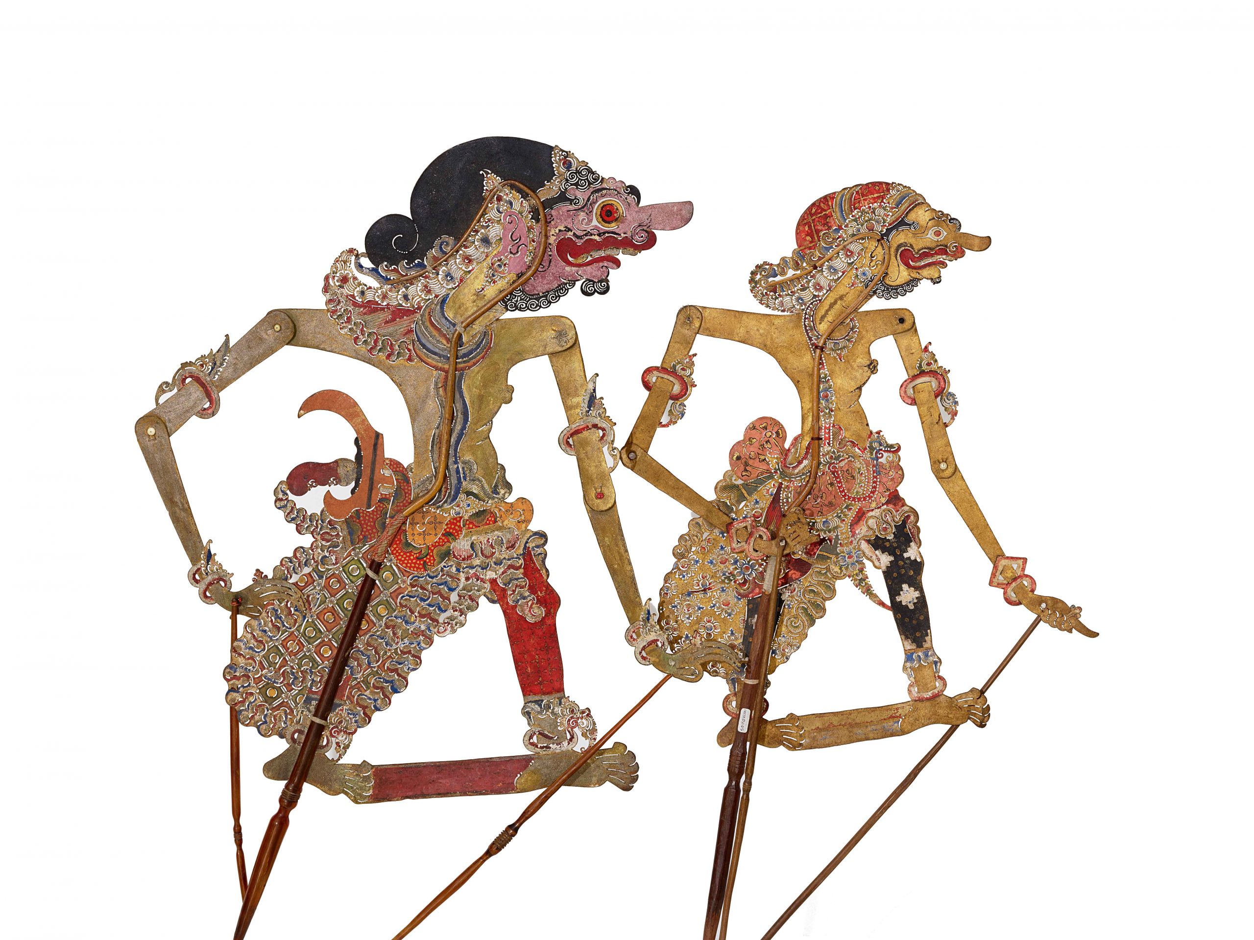  The image shows two Javanese wayang kulit shadow puppets, with the one on the left being the haughty character Duryodana.